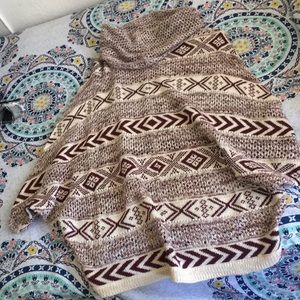 beige and burgundy poncho